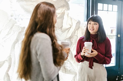 two women at work having a career growth conversation